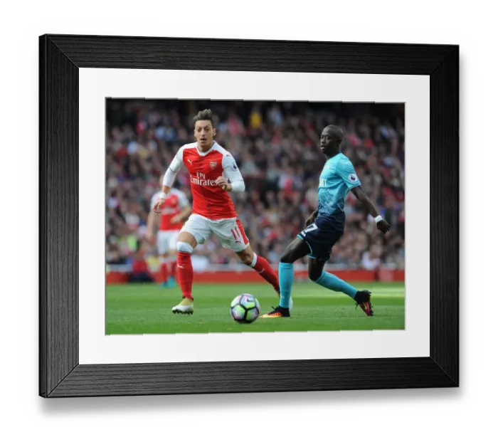 Framed Print : Arsenal's Ozil Dodges Swansea's Barrow in 2016-17 Premier League Showdown Framed Print : Arsenal's Ozil Dodges Swansea's Barrow in 2016-17 Premier League Showdown