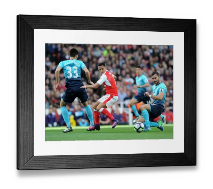 Framed Print : Alexis Sanchez Faces Intense Scrutiny from Swansea Defenders during Arsenal's 2016-17 Premier League Clash