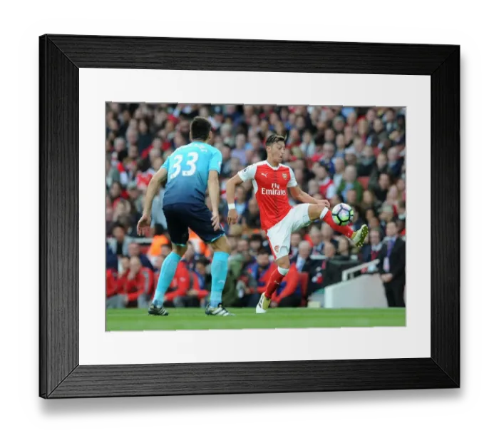 Framed Print : Mesut Ozil vs Federico Fernandez: A Battle of Midfield Maestros in Arsenal vs Swansea City, Premier League 2016-17 Framed Print : Mesut Ozil vs Federico Fernandez: A Battle of Midfield Maestros in Arsenal vs Swansea City, Premier League 2016-17