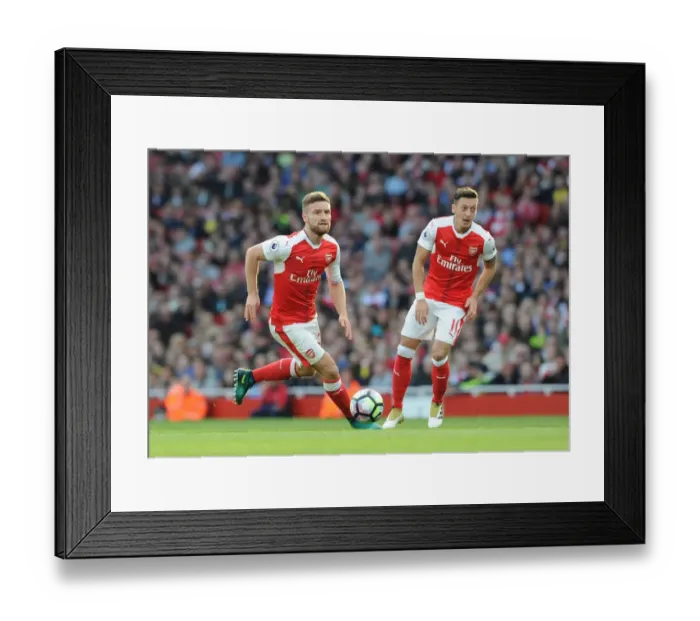 Framed Print : Arsenal's Mustafi and Ozil: A Premier League Showdown - Arsenal vs Swansea City (2016-17)