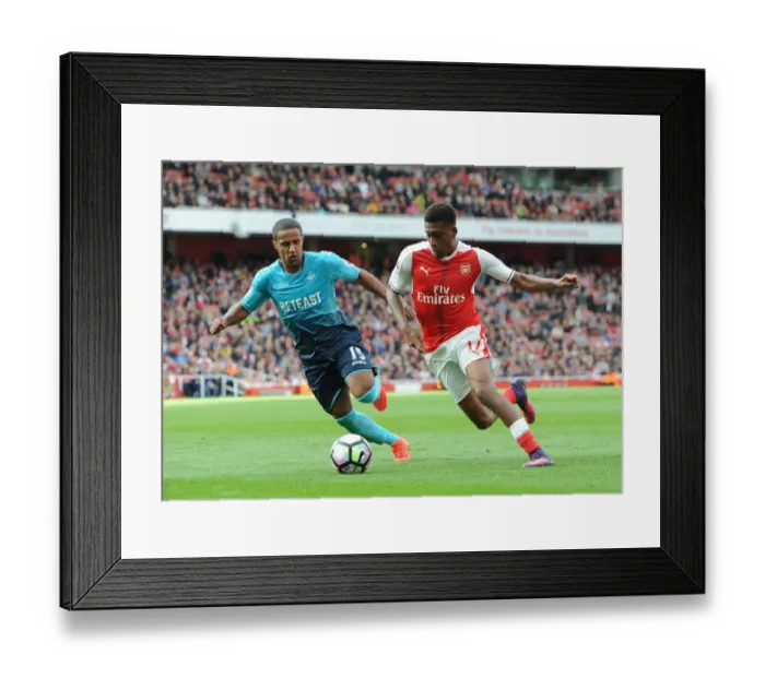 Framed Print : Arsenal vs Swansea City: Iwobi vs Routledge Clash in Premier League Battle (2016-17) Framed Print : Arsenal vs Swansea City: Iwobi vs Routledge Clash in Premier League Battle (2016-17)