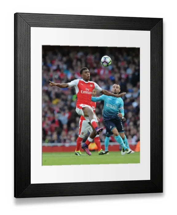 Framed Print : Intense Battle: Iwobi vs Britton in Arsenal vs Swansea Premier League Clash