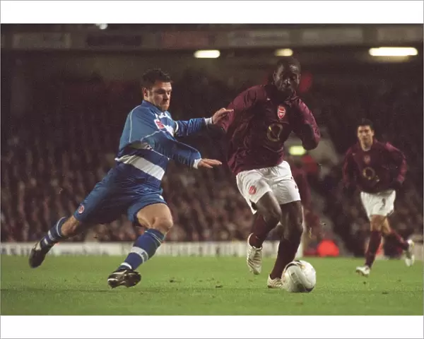 Quincy Owusu-Abeyie (Arsenal) Graeme Murty (Reading). Arsenal 3: 0 Reading