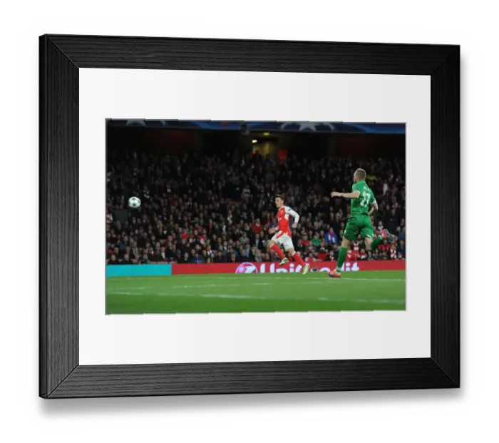Framed Print : Arsenal's Ozil Scores Fifth Goal in Champions League Victory over Ludogorets (2016-17) Framed Print : Arsenal's Ozil Scores Fifth Goal in Champions League Victory over Ludogorets (2016-17)