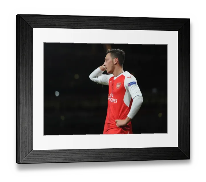Framed Print : Ozil Shines: Arsenal's Champions League Triumph over Ludogorets