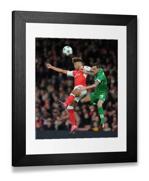Framed Print : Arsenal's Oxlade-Chamberlain Soars Past Ludogorets Minev in Champions League Clash