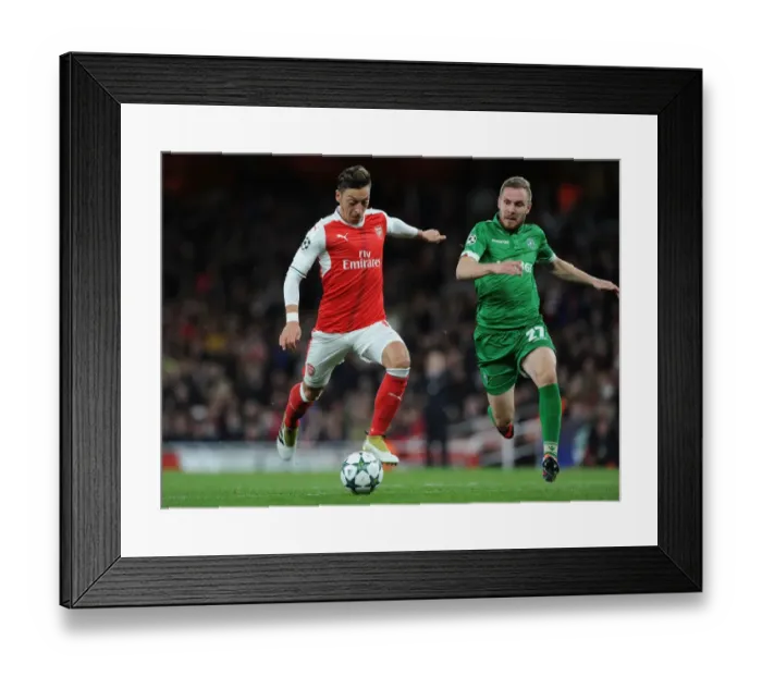 Framed Print : Mesut Ozil Scores Arsenal's Fourth Goal in Champions League Match Against Ludogorets (2016-17)