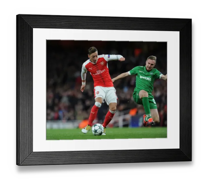 Framed Print : Mesut Ozil Scores Arsenal's Fourth Goal in Champions League Match Against Ludogorets (2016-17)