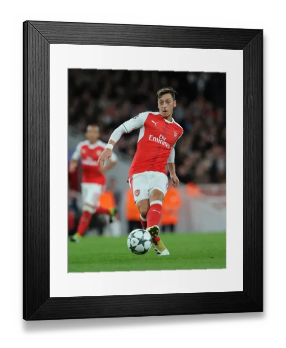 Framed Print : Arsenal's Ozil Shines in Champions League Clash Against Ludogorets