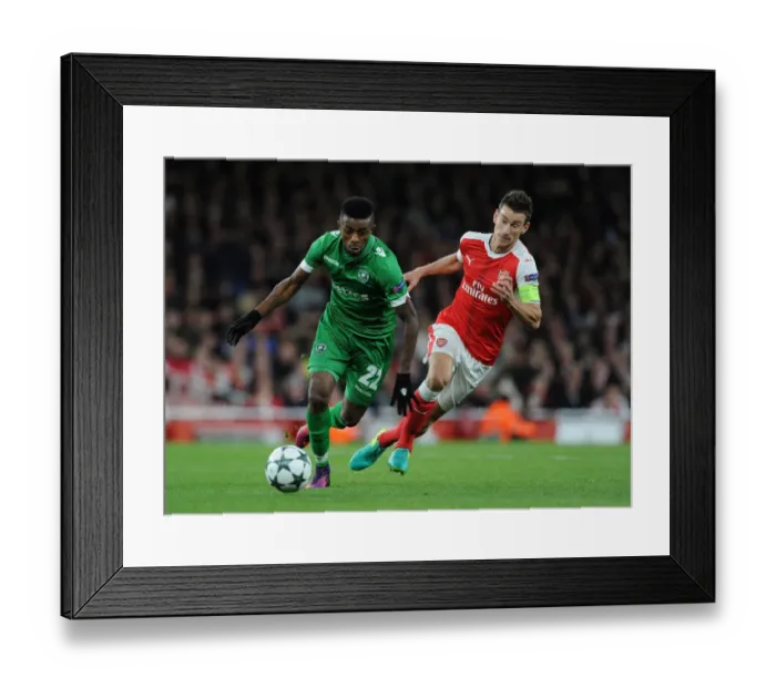 Framed Print : Arsenal vs Ludogorets: Laurent Koscielny Closes In Framed Print : Arsenal vs Ludogorets: Laurent Koscielny Closes In