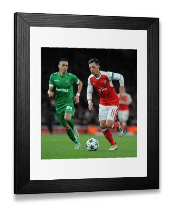 Framed Print : Arsenal vs Ludogorets: Ozil Clashes with Marcelinho in Champions League Showdown Framed Print : Arsenal vs Ludogorets: Ozil Clashes with Marcelinho in Champions League Showdown