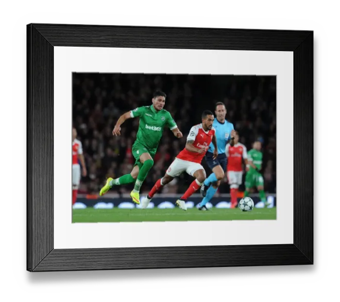 Framed Print : Arsenal vs Ludogorets: Theo Walcott Clashes with Jose Luis Palomino in the 2016-17 UEFA Champions League