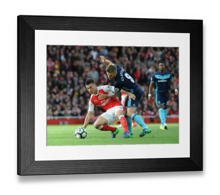 Framed Print : LONDON, ENGLAND - OCTOBER 22: Laurent Koscielny of Arsenal under pressure from Adam Clayton of Middlesbrough during Framed Print : LONDON, ENGLAND - OCTOBER 22: Laurent Koscielny of Arsenal under pressure from Adam Clayton of Middlesbrough during