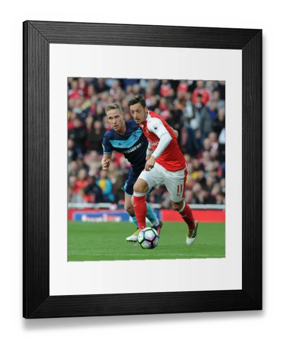 Framed Print : Mesut Ozil vs. Adam Forshaw: A Premier League Battle at Emirates Stadium (2016-17)