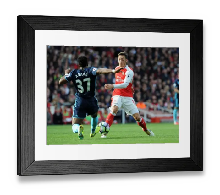 Framed Print : Mesut Ozil vs Adama Traore: Intense Battle at Emirates Stadium (Arsenal v Middlesbrough, 2016-17)