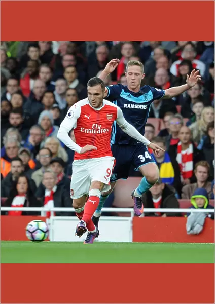 Arsenal's Lucas Perez Clashes with Middlesbrough's Adam Forshaw in Premier League Showdown