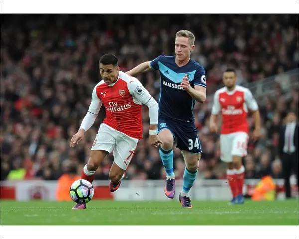 Arsenal's Alexis Sanchez Faces Off Against Middlesbrough's Adam Forshaw in Premier League Clash