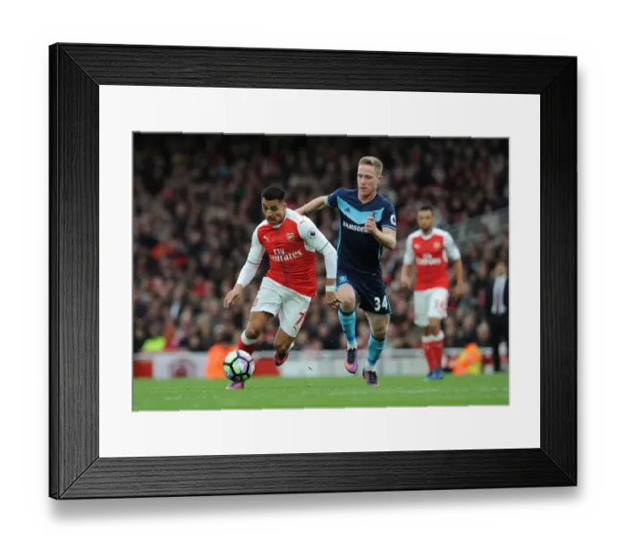 Framed Print : Arsenal's Alexis Sanchez Faces Off Against Middlesbrough's Adam Forshaw in Premier League Clash