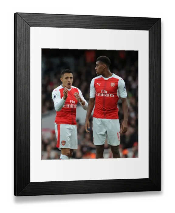Framed Print : Arsenal: Sanchez and Iwobi in Deep Conversation during Arsenal v Middlesbrough Match Framed Print : Arsenal: Sanchez and Iwobi in Deep Conversation during Arsenal v Middlesbrough Match