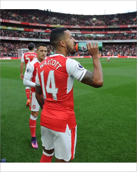 Arsenal Stars Theo Walcott and Alexis Sanchez Hydrate Before Arsenal v Middlesbrough Match, 2016-17