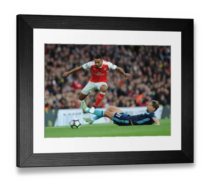 Framed Print : Arsenal's Theo Walcott Outmaneuvers Middlesbrough's Gaston Ramirez Framed Print : Arsenal's Theo Walcott Outmaneuvers Middlesbrough's Gaston Ramirez