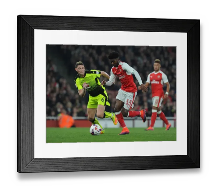 Framed Print : Arsenal's Maitland-Niles Clashes with Reading's Evans in EFL Cup Showdown