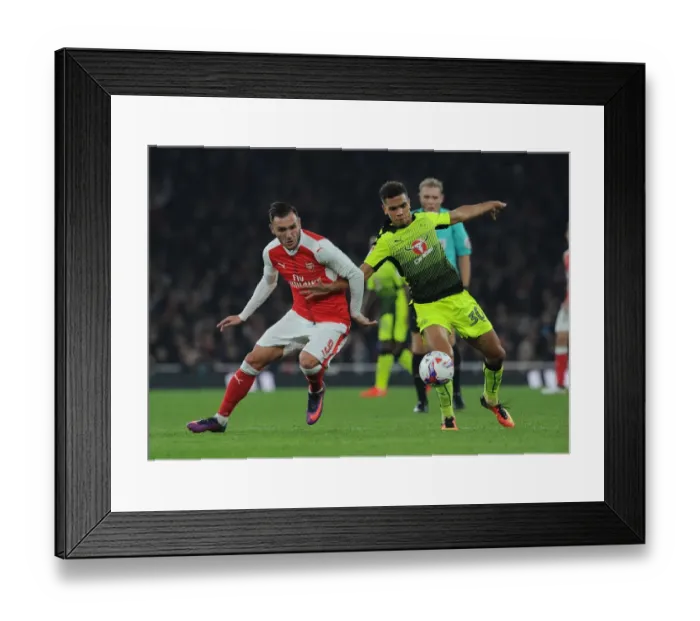 Framed Print : Arsenal's Lucas Perez Clashes with Reading's Tennai Watson in EFL Cup Showdown Framed Print : Arsenal's Lucas Perez Clashes with Reading's Tennai Watson in EFL Cup Showdown