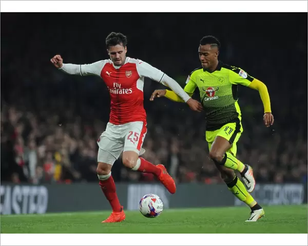 Arsenal's Carl Jenkinson Clashes with Reading's Sandro Wieser in EFL Cup Showdown