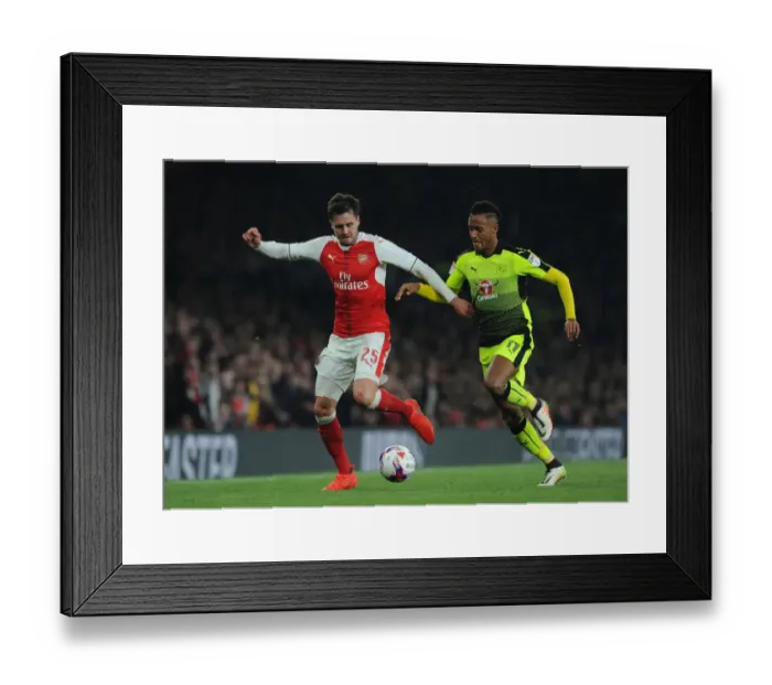 Framed Print : Arsenal's Carl Jenkinson Clashes with Reading's Sandro Wieser in EFL Cup Showdown Framed Print : Arsenal's Carl Jenkinson Clashes with Reading's Sandro Wieser in EFL Cup Showdown