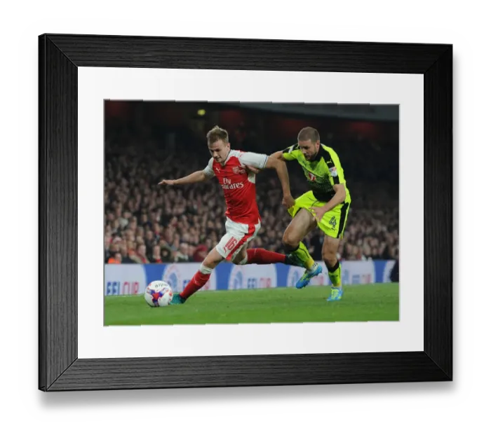Framed Print : Arsenal's Rob Holding Clashes with Reading's Joey van den Berg in EFL Cup Showdown