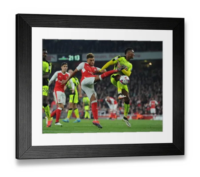 Framed Print : Arsenal's Oxlade-Chamberlain Fights Past Reading's Wieser in EFL Cup Clash