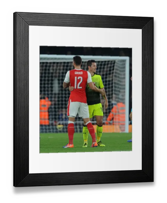 Framed Print : Arsenal's Olivier Giroud and Yann Kermorgant of Reading: A Clash in the EFL Cup Framed Print : Arsenal's Olivier Giroud and Yann Kermorgant of Reading: A Clash in the EFL Cup