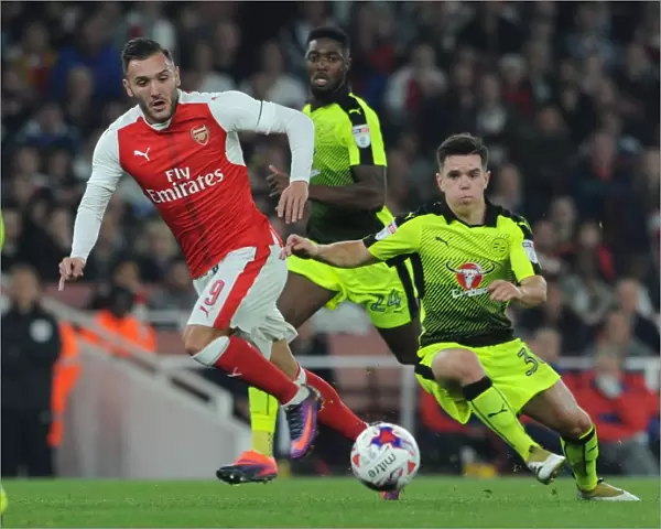 Arsenal's Lucas Perez Clashes with Reading's Liam Kelly in EFL Cup Showdown