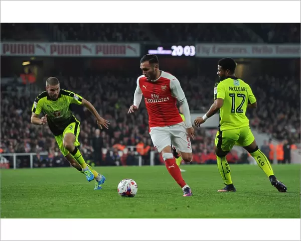 Lucas Perez (Arsenal) Joey van den Berg and Garath McCleary (Reading). Arsenal 2
