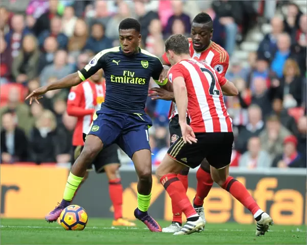 Arsenal's Alex Iwobi Faces Off Against Sunderland's Billy Jones in Premier League Clash