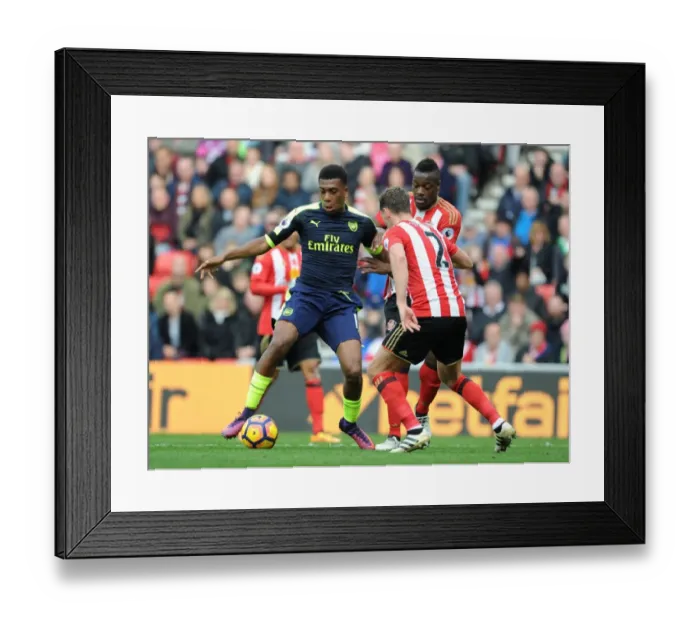 Framed Print : Arsenal's Alex Iwobi Faces Off Against Sunderland's Billy Jones in Premier League Clash Framed Print : Arsenal's Alex Iwobi Faces Off Against Sunderland's Billy Jones in Premier League Clash