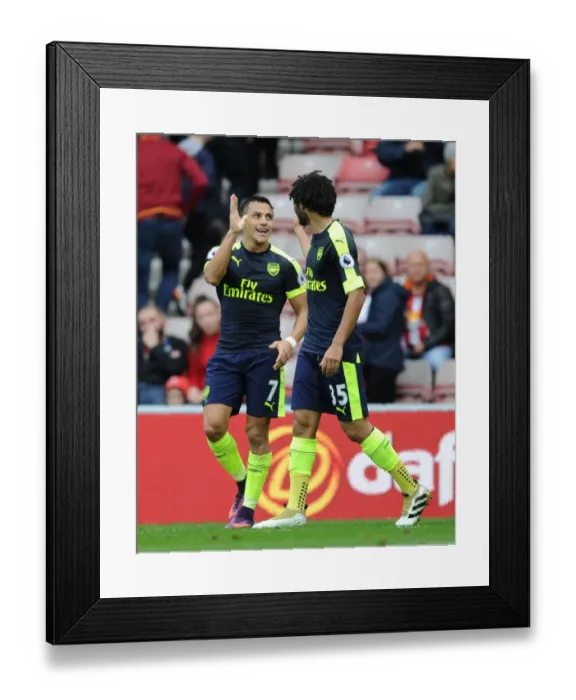 Framed Print : Alexis Sanchez and Mohamed Elneny Celebrate Arsenal's Four-Goal Lead Over Sunderland (2016-17) Framed Print : Alexis Sanchez and Mohamed Elneny Celebrate Arsenal's Four-Goal Lead Over Sunderland (2016-17)