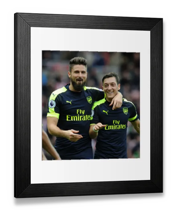 Framed Print : Arsenal's Unstoppable Duo: Giroud and Ozil's Euphoric Goal Celebration (2016-17) - Sunderland vs. Arsenal