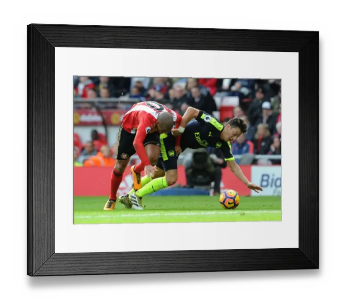 Framed Print : Mesut Ozil vs. Wahbi Khazri: Tense Moment in Sunderland vs. Arsenal Premier League Clash Framed Print : Mesut Ozil vs. Wahbi Khazri: Tense Moment in Sunderland vs. Arsenal Premier League Clash