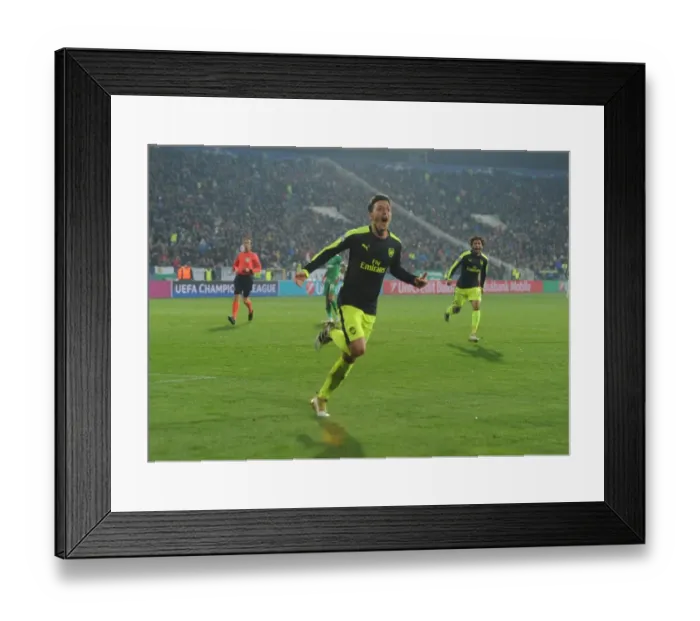 Framed Print : Mesut Ozil's Decisive Goal: Arsenal's Victory over Ludogorets Razgrad in the 2016-17 UEFA Champions League
