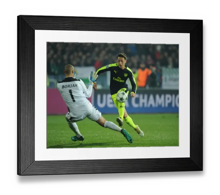 Framed Print : Mesut Ozil Scores the Third Goal: Arsenal's Victory over Ludogorets Razgrad in the UEFA Champions League (2016-17)