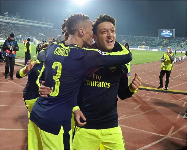 Mesut Ozil and Kieran Gibbs Celebrate Arsenal's Third Goal Against Ludogorets Razgrad in 2016-17 UEFA Champions League