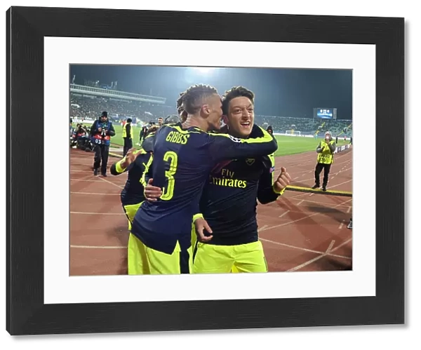 Mesut Ozil and Kieran Gibbs Celebrate Arsenal's Third Goal Against Ludogorets Razgrad in 2016-17 UEFA Champions League