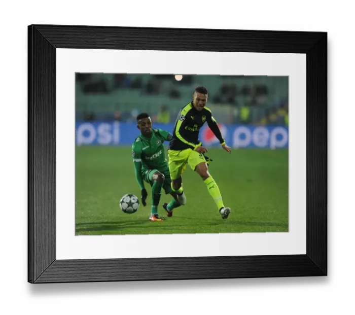 Framed Print : Arsenal's Kieran Gibbs Faces Off Against Ludogorets Jonathan Cafu in UEFA Champions League Clash Framed Print : Arsenal's Kieran Gibbs Faces Off Against Ludogorets Jonathan Cafu in UEFA Champions League Clash