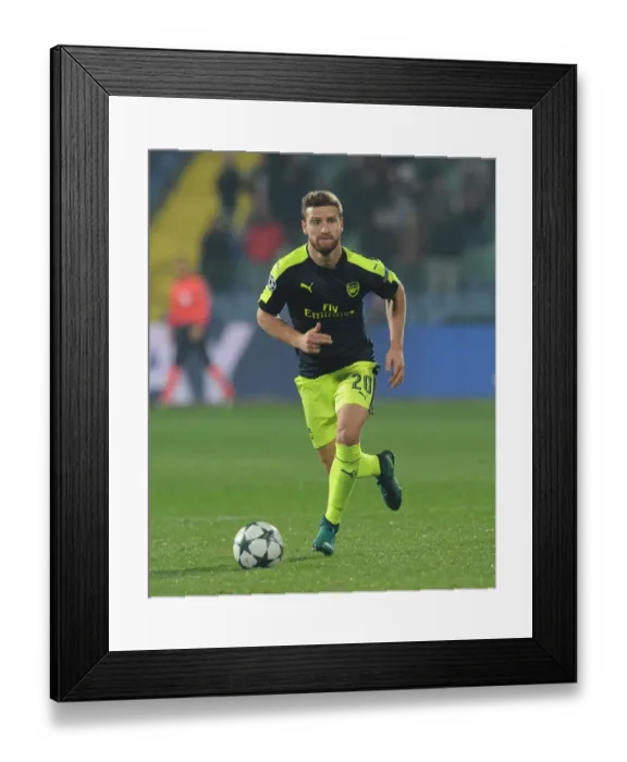 Framed Print : Shkodran Mustafi: Arsenal's Unyielding Defender in UEFA Champions League Clash against Ludogorets, 2016