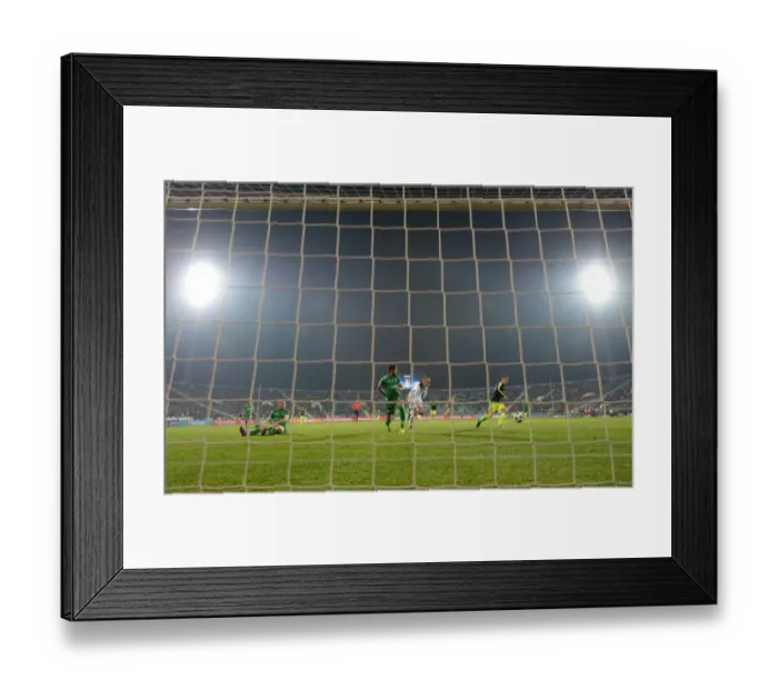 Framed Print : Mesut Ozil Scores Third Goal Against Ludogorets: Arsenal's Victory in UEFA Champions League
