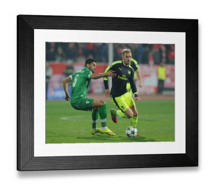 Framed Print : Ramsey vs. Palomino: A Champions League Showdown - Arsenal's Aaron Ramsey Clashes with Ludogorets Jose Luis Palomino Framed Print : Ramsey vs. Palomino: A Champions League Showdown - Arsenal's Aaron Ramsey Clashes with Ludogorets Jose Luis Palomino