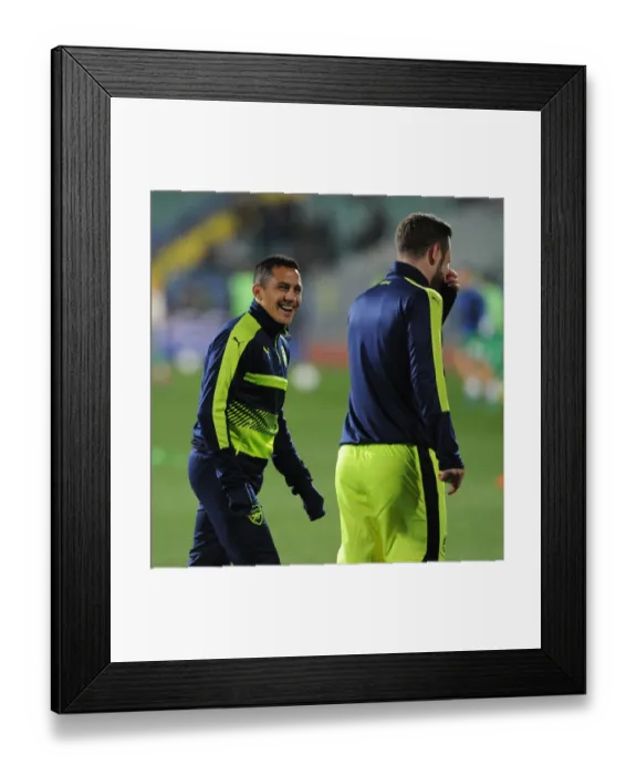 Framed Print : Alexis Sanchez Warms Up Ahead of Arsenal's UEFA Champions League Clash with Ludogorets Razgrad