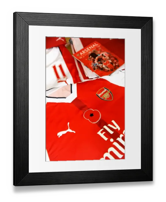 Framed Print : Arsenal Football Club: Poppy-Emblazoned Jerseys in Home Changing Room Before Arsenal vs. Tottenham (2016-17)