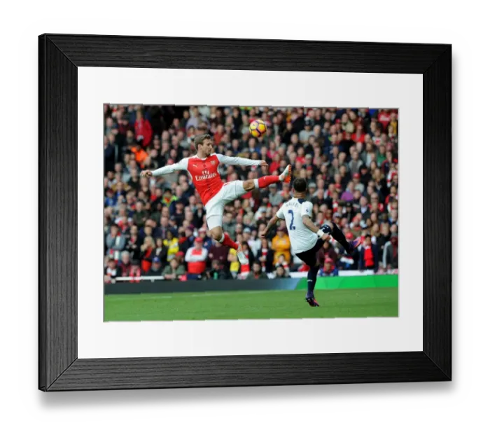 Framed Print : Arsenal vs. Tottenham: Monreal Clears Ball Amidst Intense Rivalry (Premier League 2016-17)